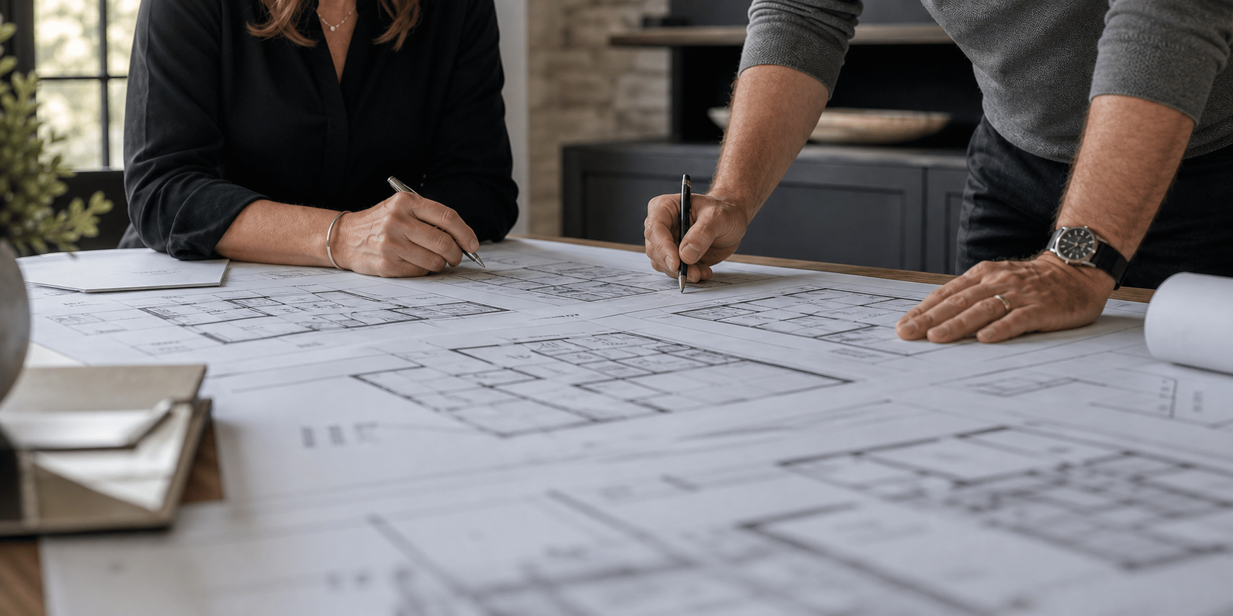 Architects reviewing floorplan at large table