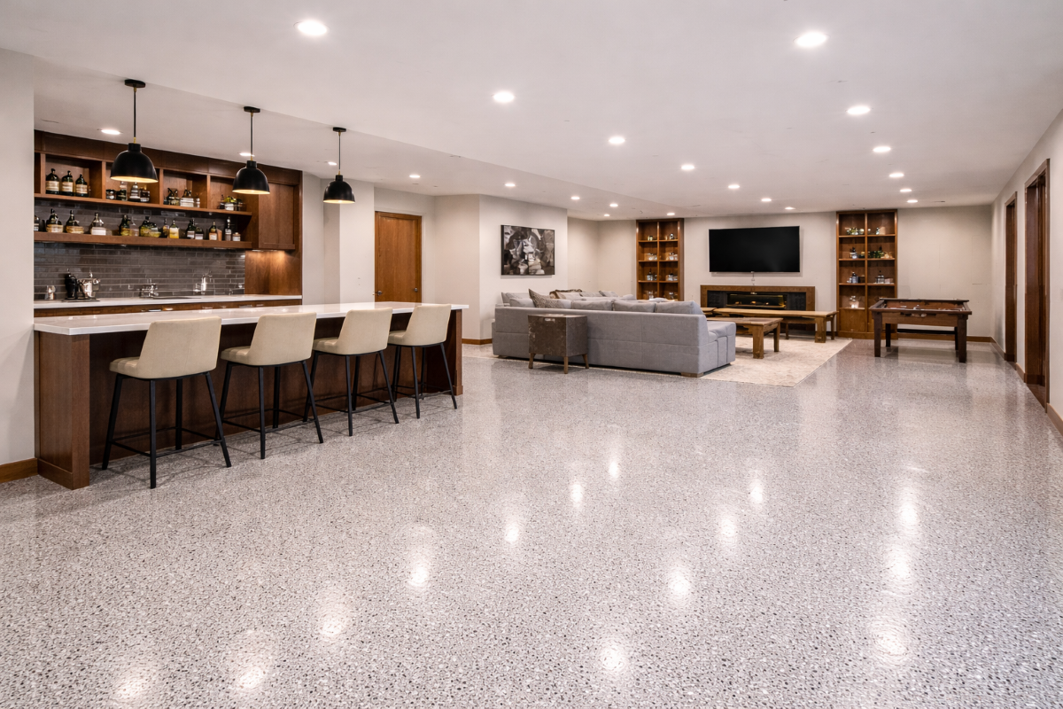 Remodeled basement with entertainment area, wet bar and epoxy flooring
