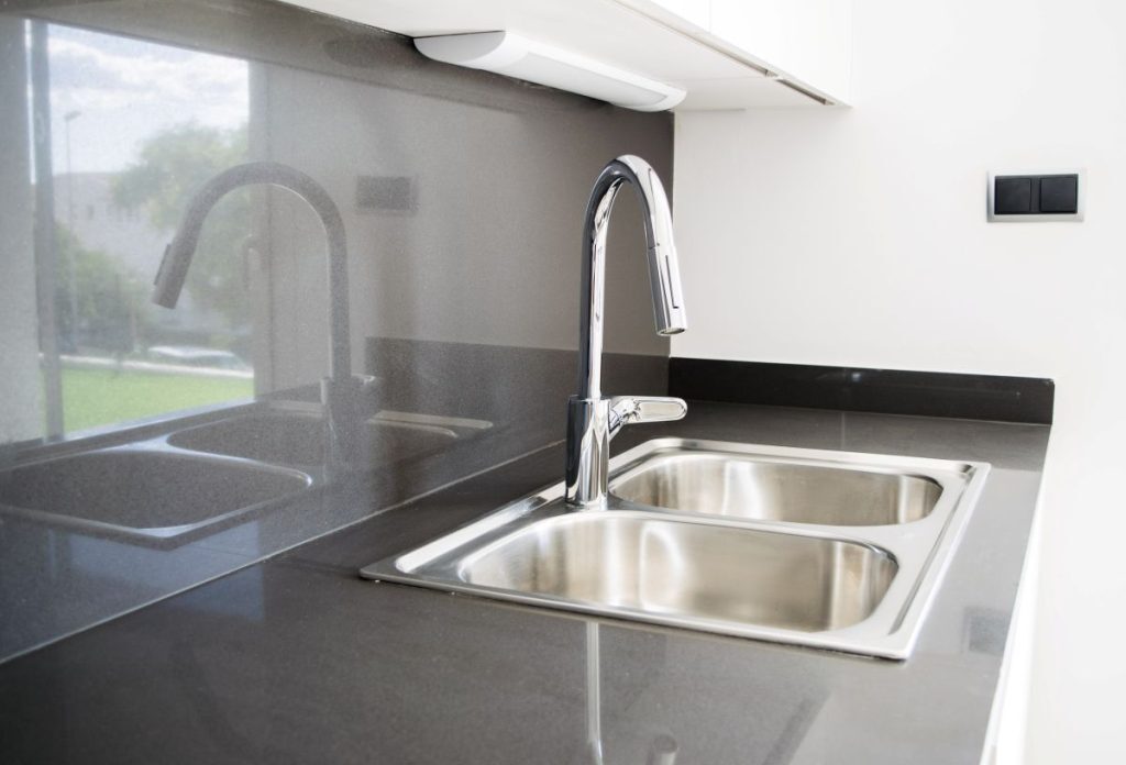 Stainless steel double-bowl sink in kitchen