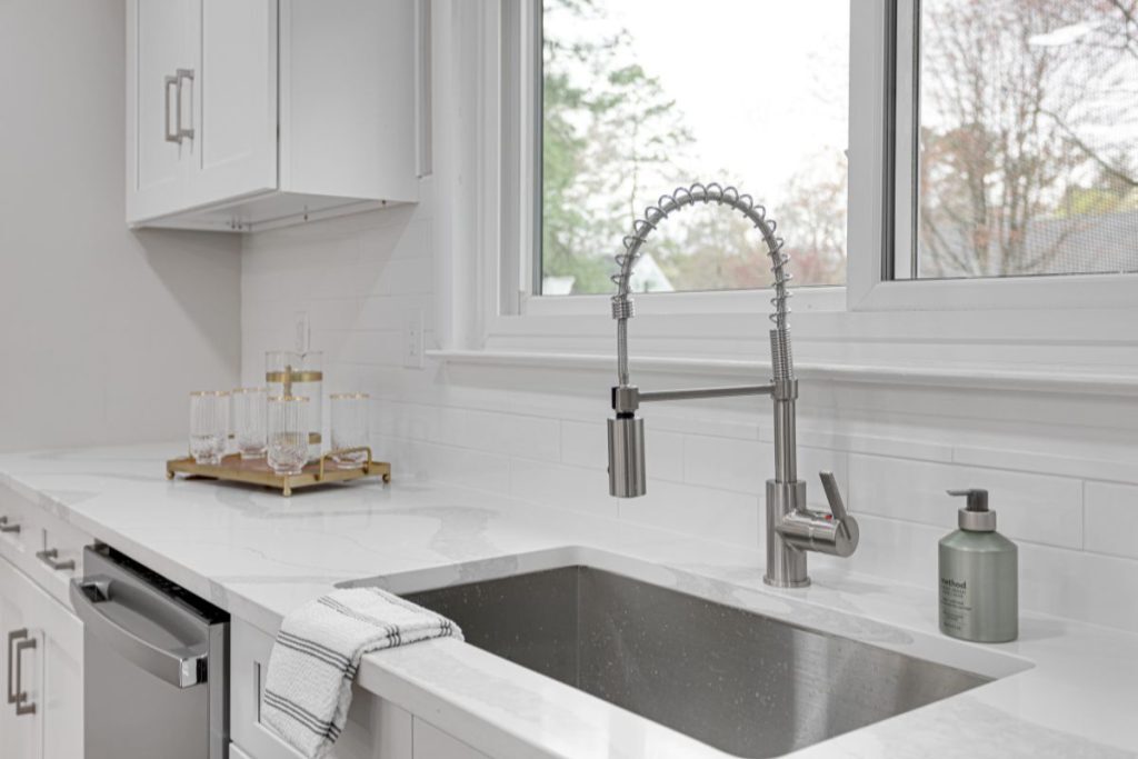 Undermount sink in a white modern kitchen 