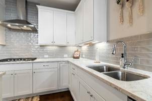 Remodeled kitchen with tile backsplash
