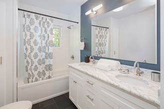 Family bathroom remodel with double sink and rounded countertops