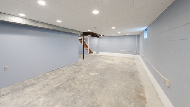 unfinished basement during home remodel project that has been repaired from water damage