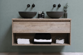 Floating wood bathroom vanity with two dark vessel sinks, wall-mounted faucets, and open towel storage.