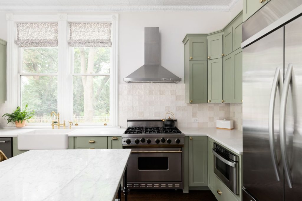 Sage green cabinets in a remodeled kitchen