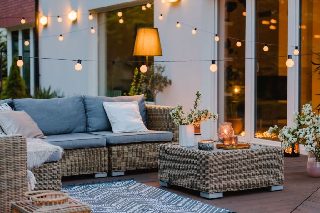 outdoor patio lounge area with string lights