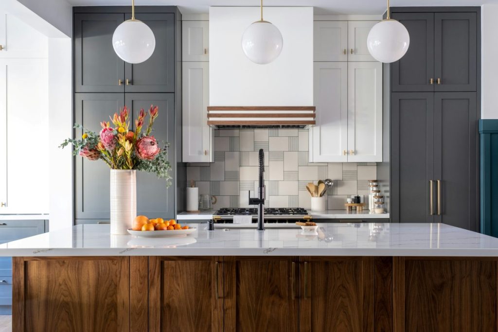 Remodeled kitchen with quartz countertop and two-toned cabinets