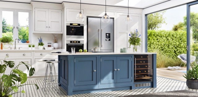 a bright modern kitchen with cream cabinets and a large blue kitchen island with storage and a wine fridge 