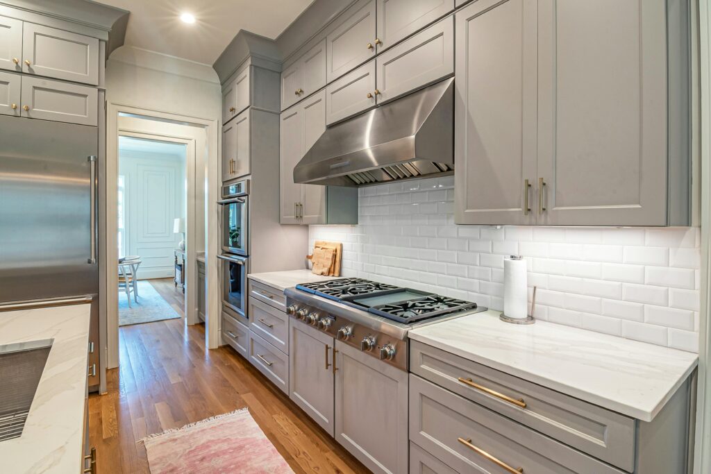 Modern kitchen remodel with custom cabinetry and tile backsplash