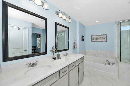 Master bathroom with double vanity and separate tub and shower 